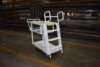 Industrial shelf ladder cart with spring-loaded 3-step ladder, steel construction, and 6 inch poly wheels